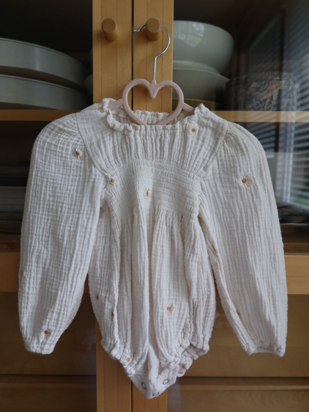 Cream Long-Sleeve Smocked Baby One-Piece Bodysuit